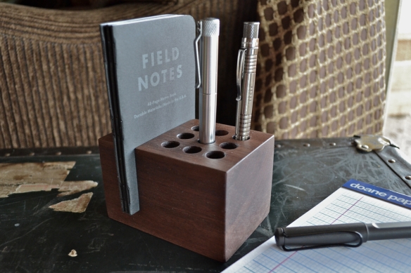 Handmade walnut pen and pocket notebook holder $55. Other configurations available (via Clicky Post)